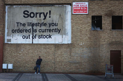 Graffiti by Banksy; photo by Bruce Krasting https://www.flickr.com/photos/bruce_krasting/7695349260